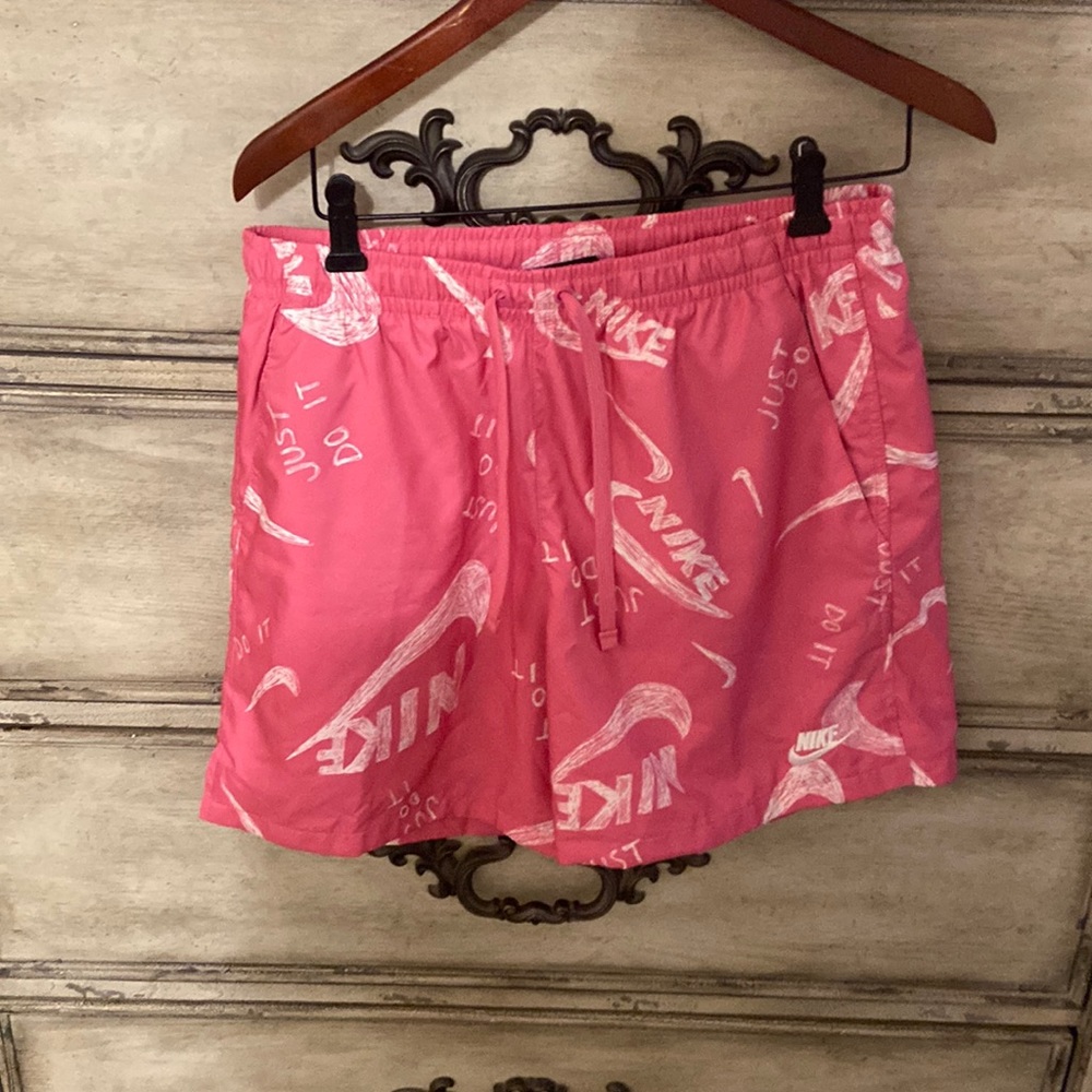 Nike mesh lined sportswear pink and white.